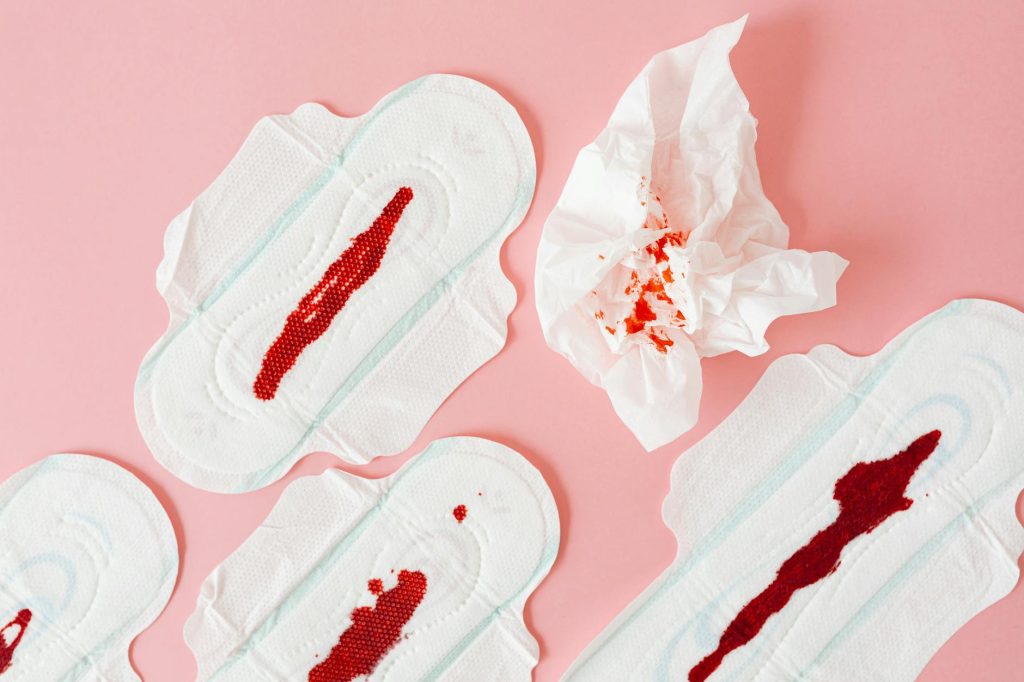 close up of menstrual pads with blood