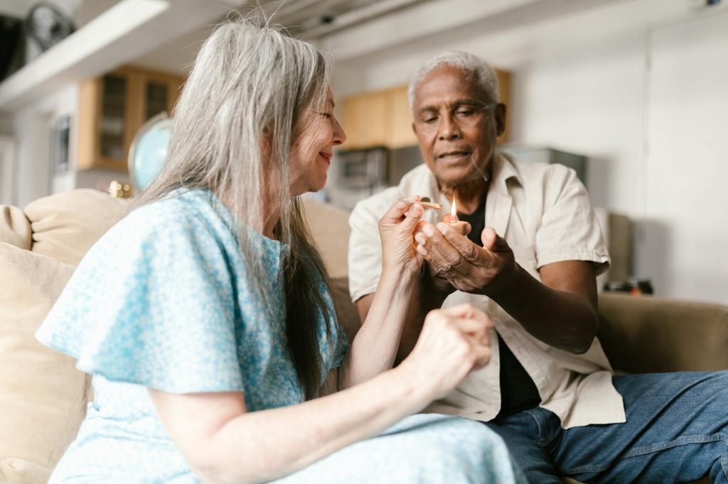elderly woman lighting up a joint